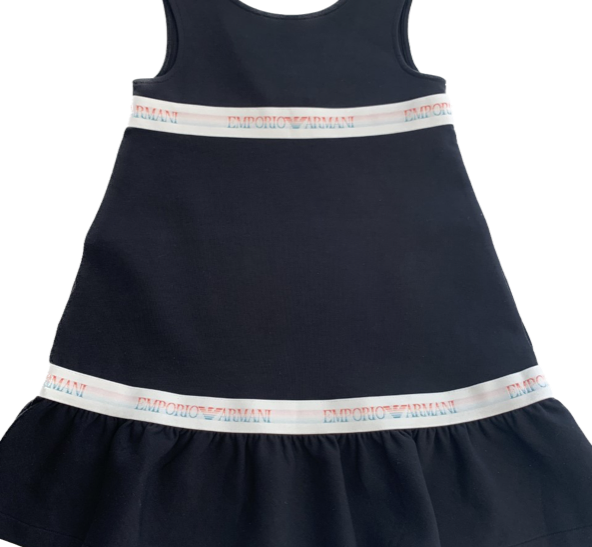Dark navy blue cotton jersey dress for girls with V-shaped backline, and a light ruffle at the bottom