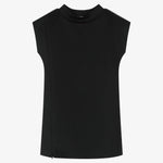 A structured black dress for girls with side openings, extended shoulders and a mock neck stretch